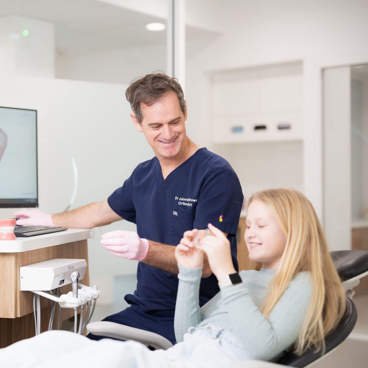 a Perth orthodontist having a welcoming appointment with a young girl
